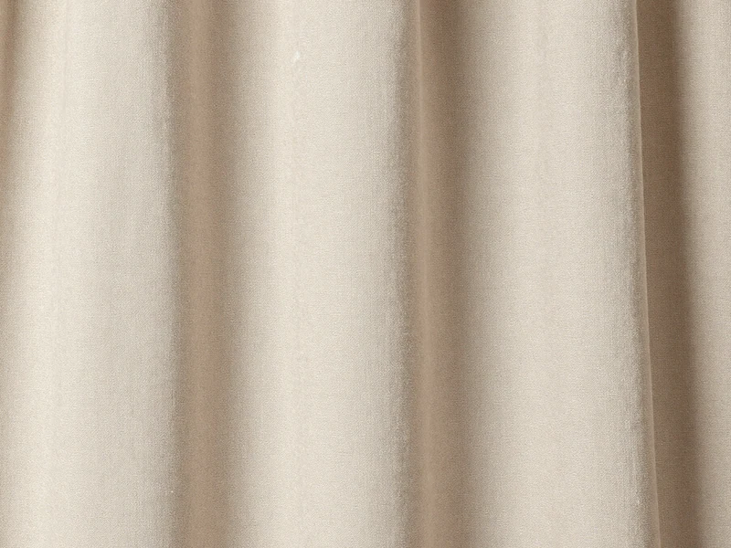 Textil neutro en pliegues suaves como apoyo visual editorial.